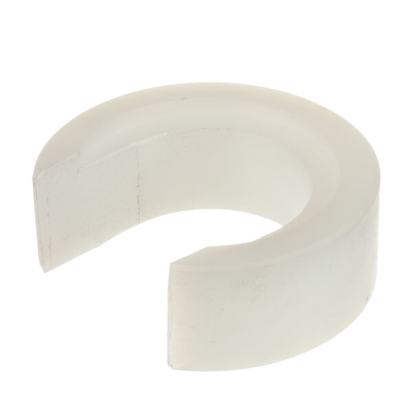 A white plastic ring with a hole in the center.