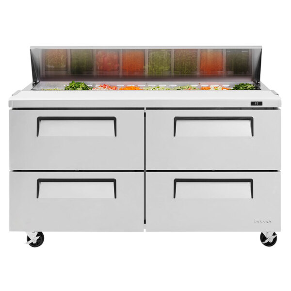 A stainless steel Turbo Air refrigerated sandwich prep table with drawers.