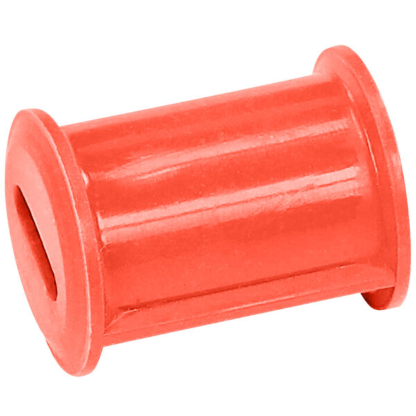 A red plastic cylinder with a slot.