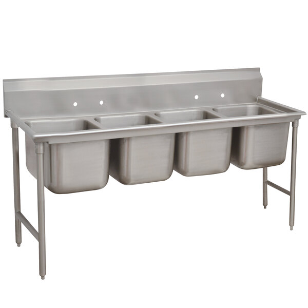 A stainless steel Advance Tabco four compartment sink.