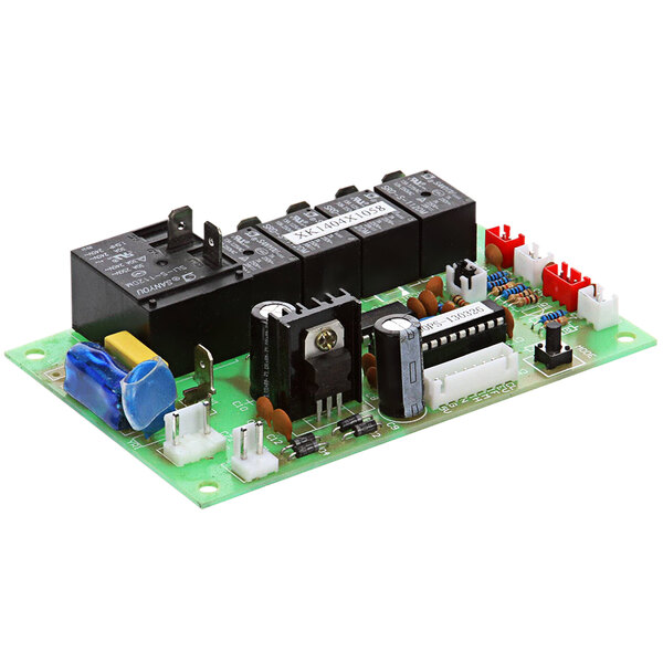 A green Maxx Ice control board with various electronic components.