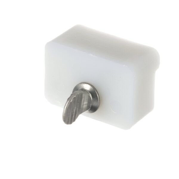 A white plastic block with a metal handle.