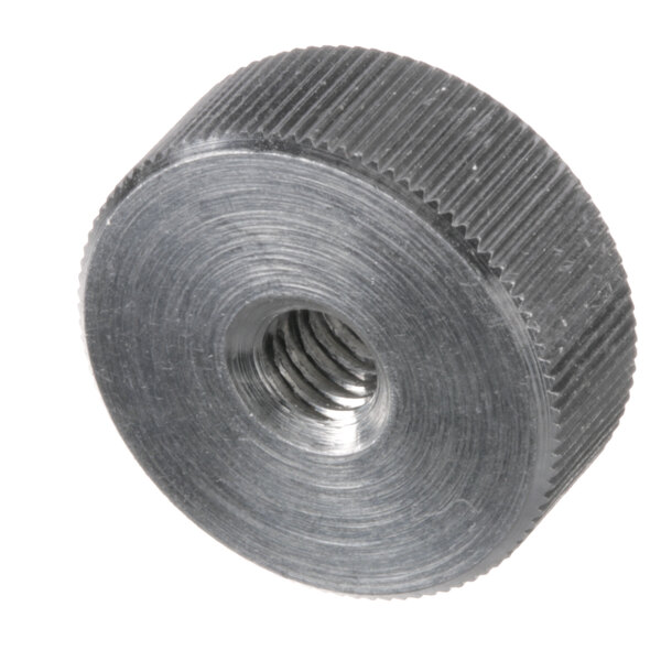 A close-up of a Dynamic Mixers thumb screw in a metal tube.
