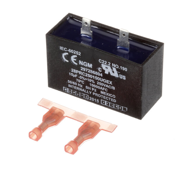 A black rectangular Frigidaire Commercial capacitor with white text.