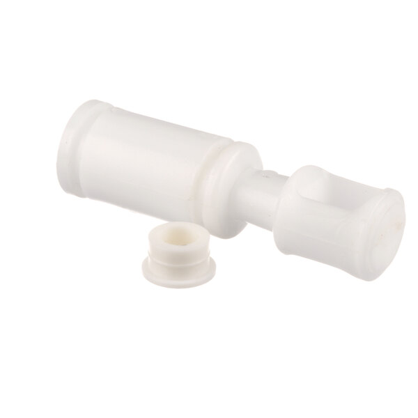 The white plastic Donper America draw valve piston with a small hole.