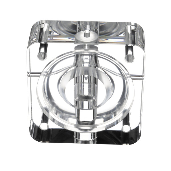 A clear plastic valve body with a metal ring on a white background.