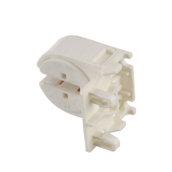 A white plastic Anvil America light bulb connector with two holes.