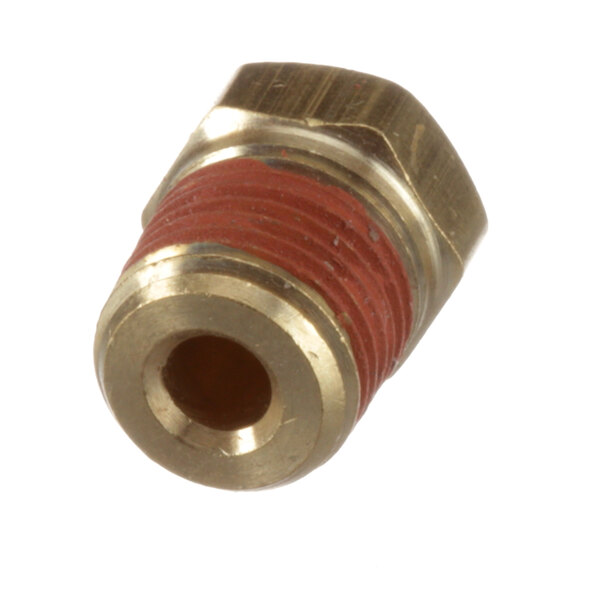 A close-up of a metal Thermodyne plug with a brass fitting and red nut.