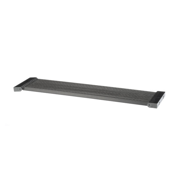 A metal shelf with a grey rectangular object with holes on it.