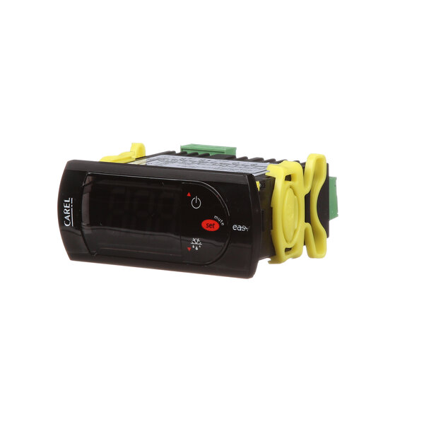 A black and yellow digital Turbo Air Refrigeration temperature controller.