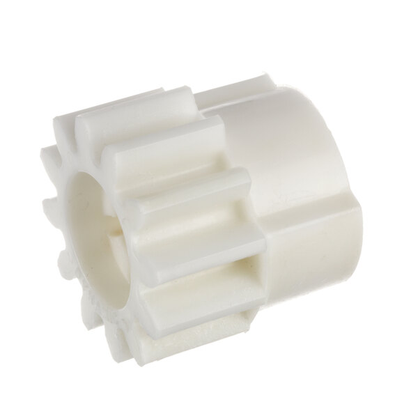 A white plastic gear with a hole.