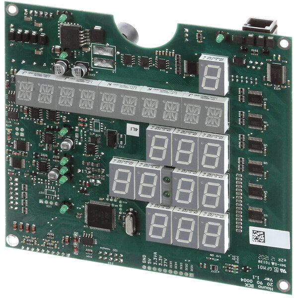 A Blodgett BCM control kit with a green circuit board with white numbers and a number of different sized wires.