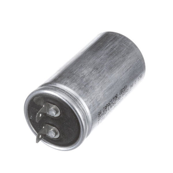 A round metal capacitor with black casing.