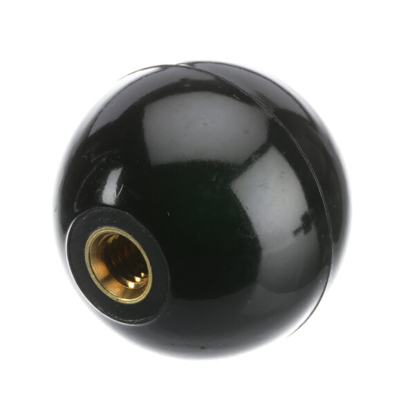 A black round knob with a gold screw.