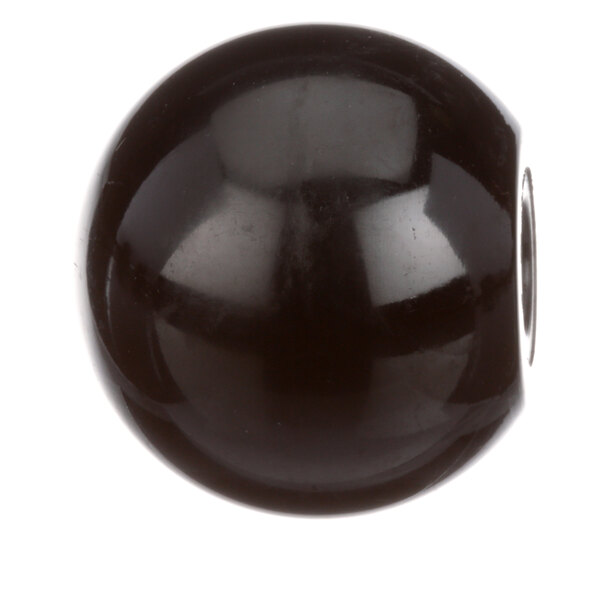 A black round knob with a silver screw.