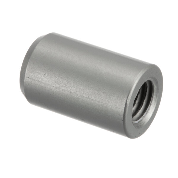 A close-up of a stainless steel threaded nut on a metal cylinder.