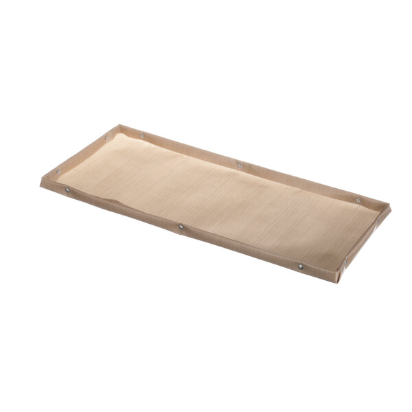 A rectangular white Teflon cover on a wooden tray.
