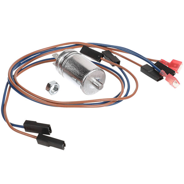 A Moffat capacitor relocation kit with a small metal cylinder and wires.