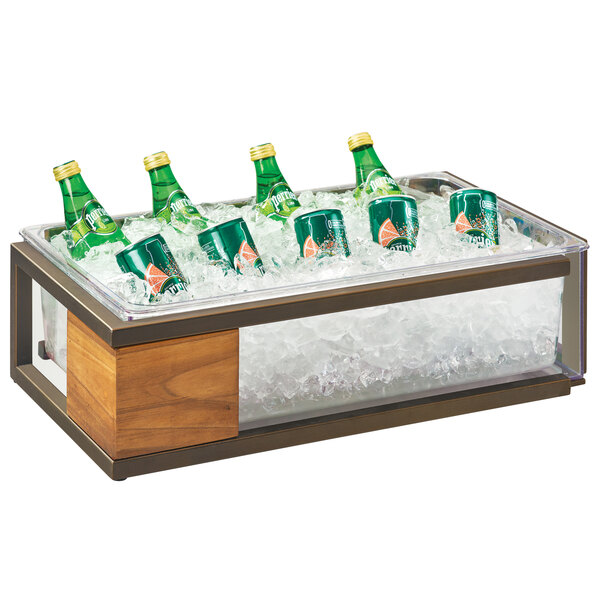 A Cal-Mil Sierra rustic pine ice housing with a green bottle and two green cans in ice.