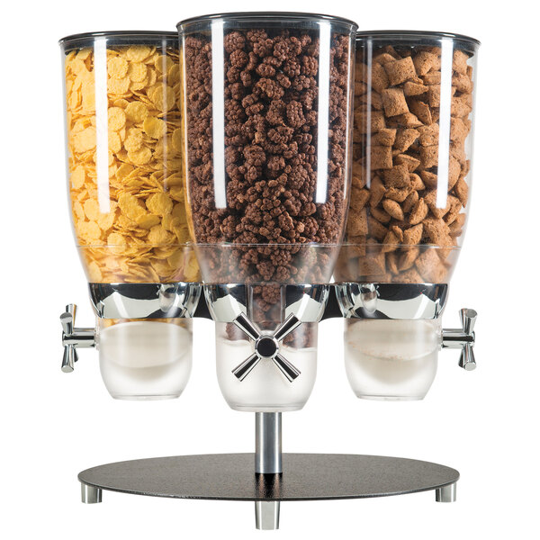 A Cal-Mil black rotating cereal dispenser with 3 glass canisters filled with cereal and other food.
