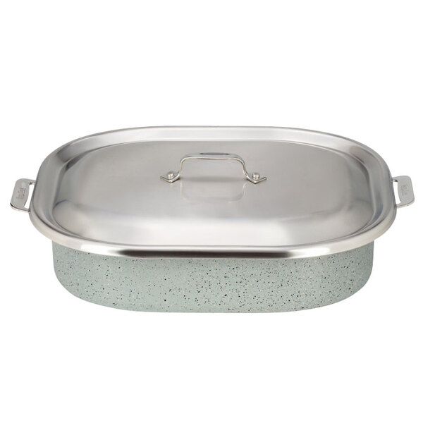 A Bon Chef stainless steel roasting pan with a lid on a kitchen counter.