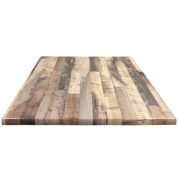 A wood table top with a rustic finish.