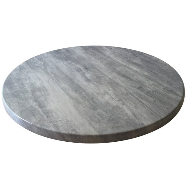 A Holland Bar Stool grey circular table top.