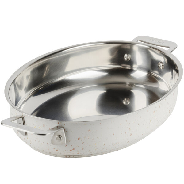 A silver stainless steel oval pan with handles.