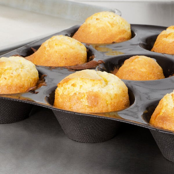 Bake'n Joy corn muffins in a muffin tin on a counter.