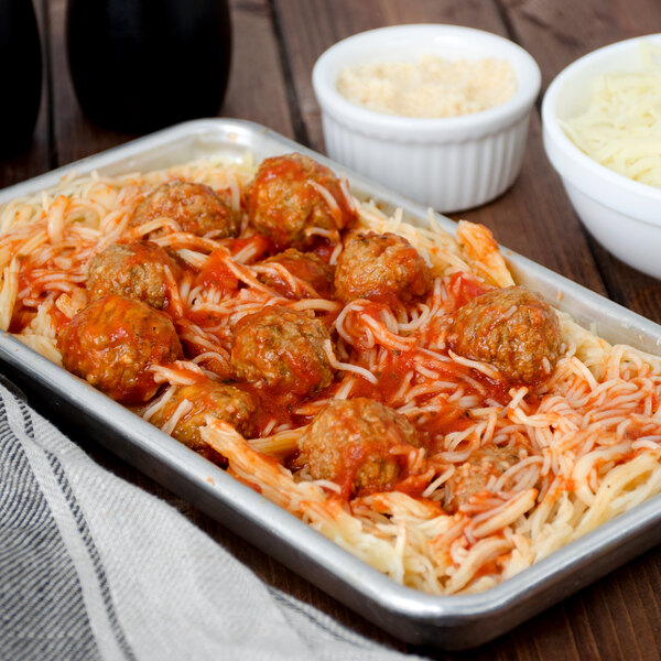 A tray of Napoli capellini pasta with spaghetti and meatballs.