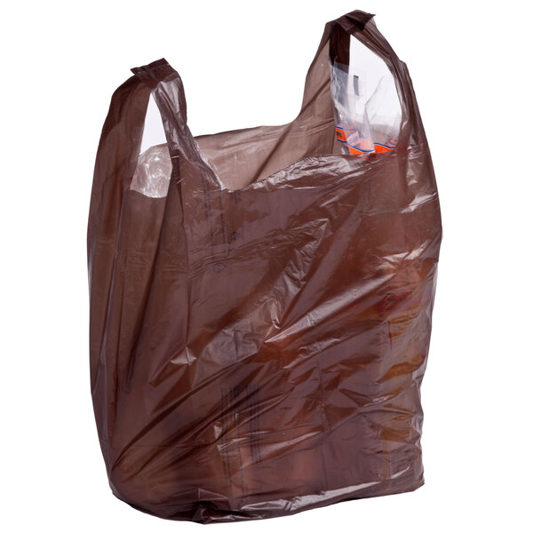 A brown plastic t-shirt bag with plastic bags inside.