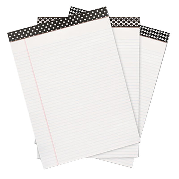 A stack of Universal narrow ruled writing pads with black and white polka dots on top.
