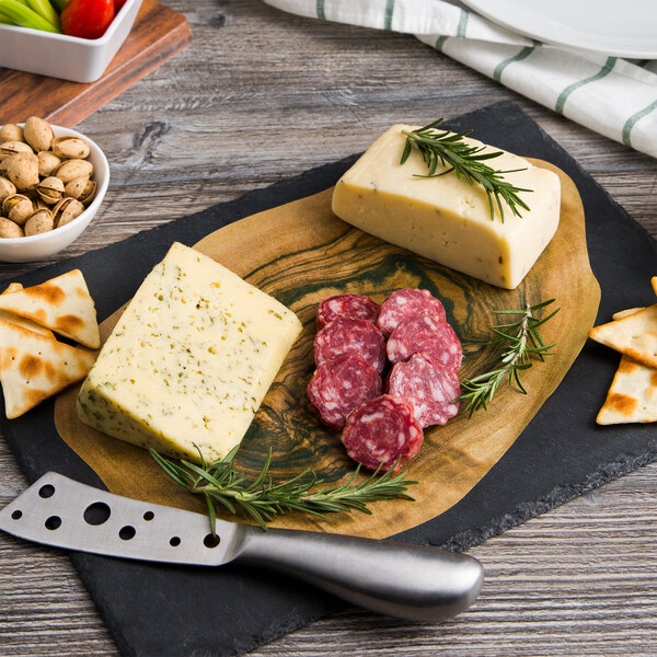 American Metalcraft olive wood cheese paper on a wooden board with cheese and crackers, a knife, and a sprig of rosemary.