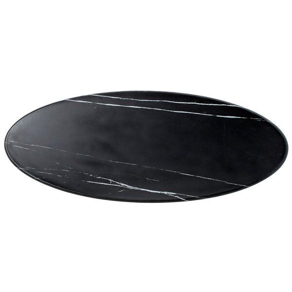 An oval black marble melamine serving board.