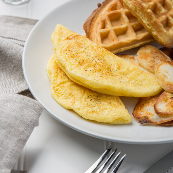 A plate with a 6" plain egg omelette on a white surface.