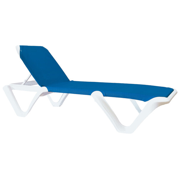 A white chaise lounge chair with blue sling seat.
