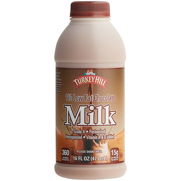 A close up of a Turkey Hill 1% Low Fat Chocolate Milk bottle with a brown label.