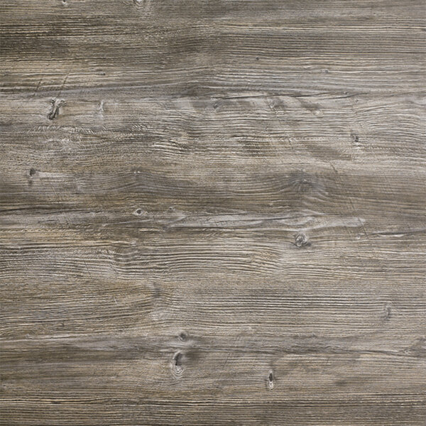 A close up of a wood surface on a Grosfillex Vintage Pine table top.