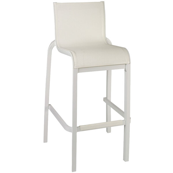 A Grosfillex Sunset Glacier White resin bar stool with a white sling seat.
