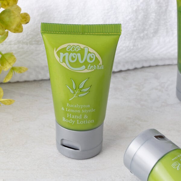 A green bottle of Noble Eco Novo Terra hand and body lotion with white text and a flip-top cap.