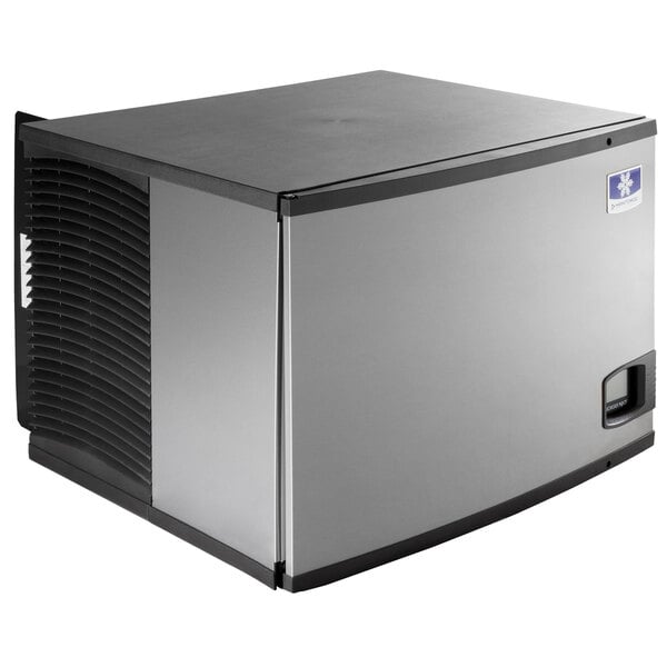 A large rectangular Manitowoc air cooled ice machine with a black and silver surface.