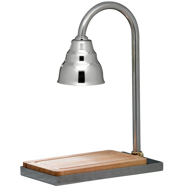 A Bon Chef carving station with a chrome lamp above a wooden surface.