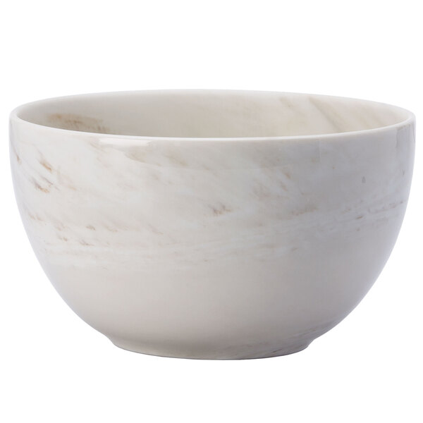 A white Oneida porcelain bowl with a marble pattern.