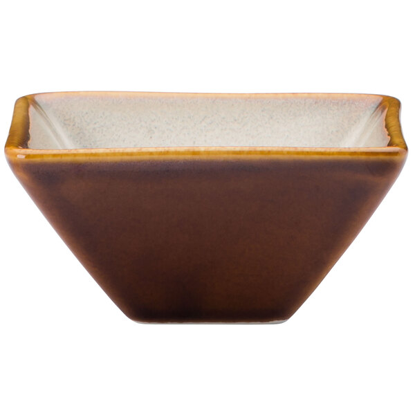 A brown square Oneida Rustic Sama porcelain bowl with a white rim.