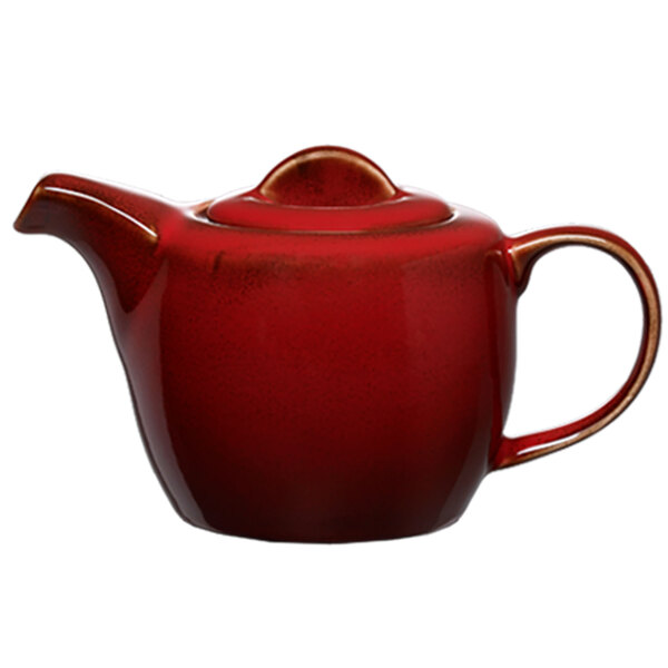 A red teapot with a handle and lid.