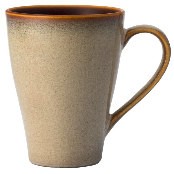 A white Sama porcelain coffee mug with a brown handle.