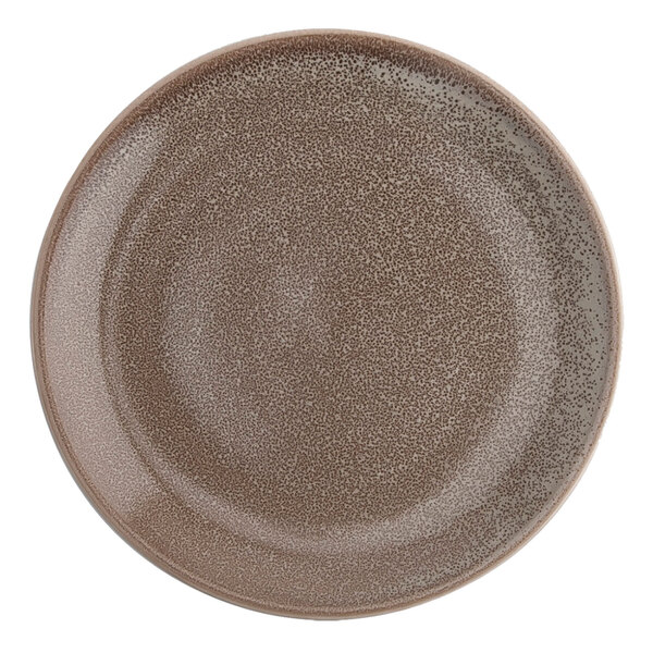 A white porcelain round plate with a brown speckled design.