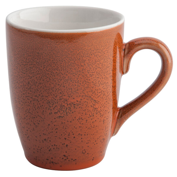 A brown Terra Verde Cotta coffee mug with a handle and speckled design.