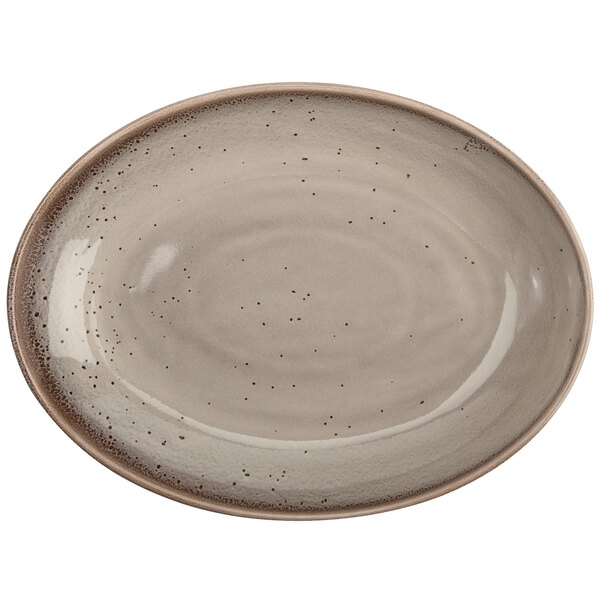 A white porcelain oval bowl with speckled design.