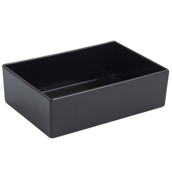 A black rectangular Bon Chef bowl with a sandstone finish on a white counter.